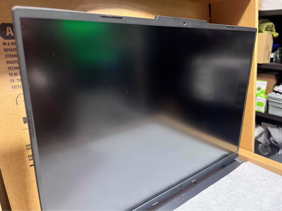 ASUS TUF F16 Core 5 RTX 3050 laptop display with screen reflection and integrated webcam at the top bezel