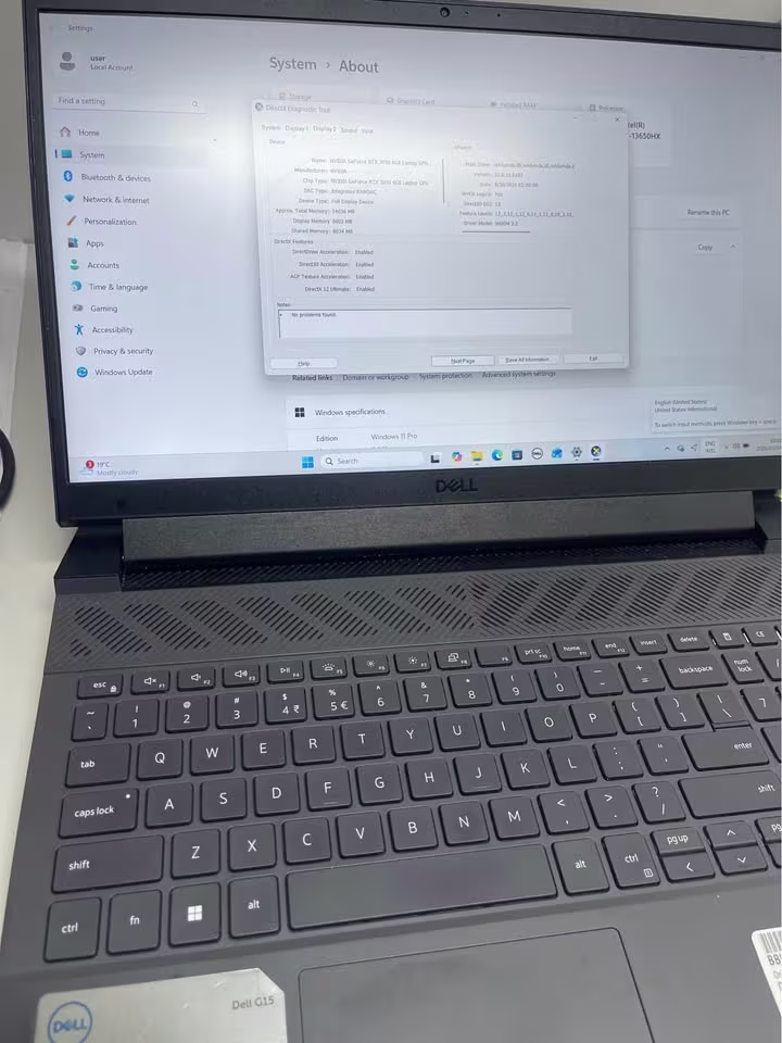 Dell G15 5530 gaming laptop close view highlighting the speaker grill, white backlit keyboard, and HD webcam integrated into the top display bezel