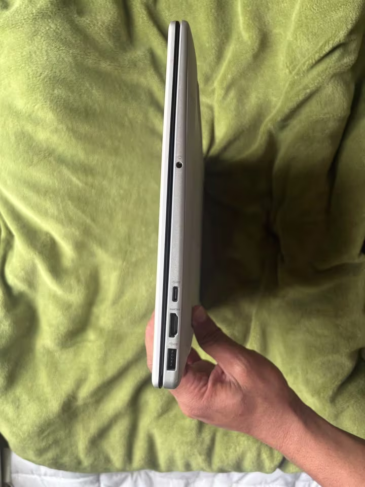 HP 15 laptop left side view showing headphone jack, USB-C port, HDMI port, and USB-A port