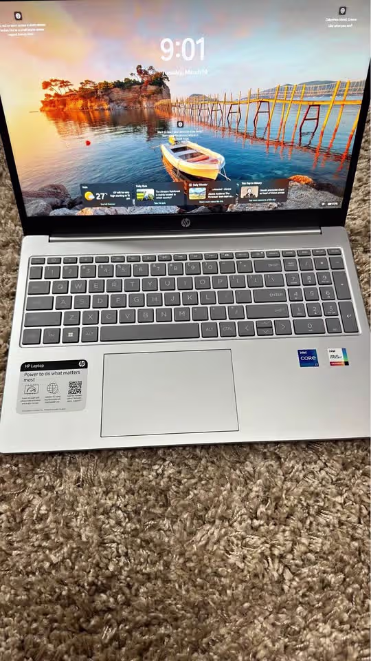 HP 15 laptop top view showing vibrant, high-resolution FHD display with sharp colours and clarity.