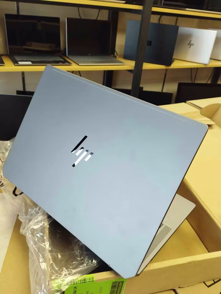 HP OmniBook Ultra Ryzen AI 9 laptop back side view showing sky blue metal lid with reflective HP logo