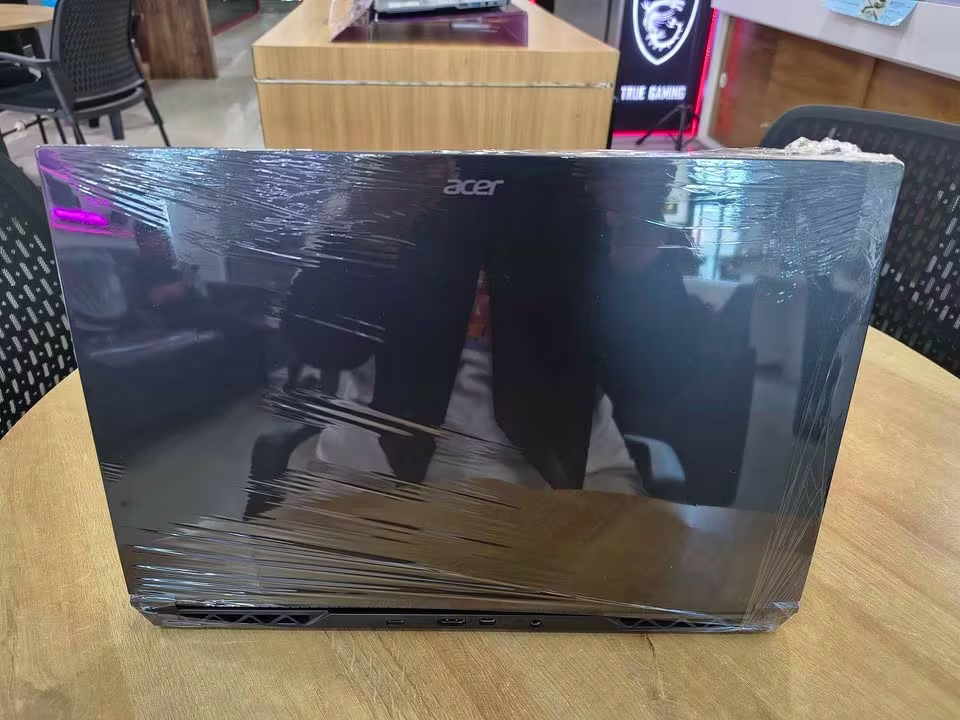 Acer ALG gaming laptop with Intel Core i5 and RTX 3050, showing rear connectivity including USB 3.2 Type-A, two USB 3.2 Type-C, HDMI, and thermal cooling vents