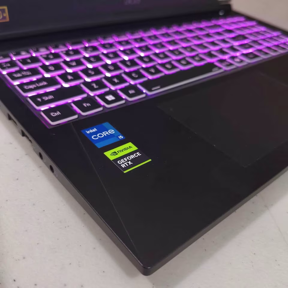 Acer ALG gaming laptop with Intel Core i5 processor and NVIDIA GeForce RTX graphics, shown in a close-up view of its multi-colour backlit keyboard