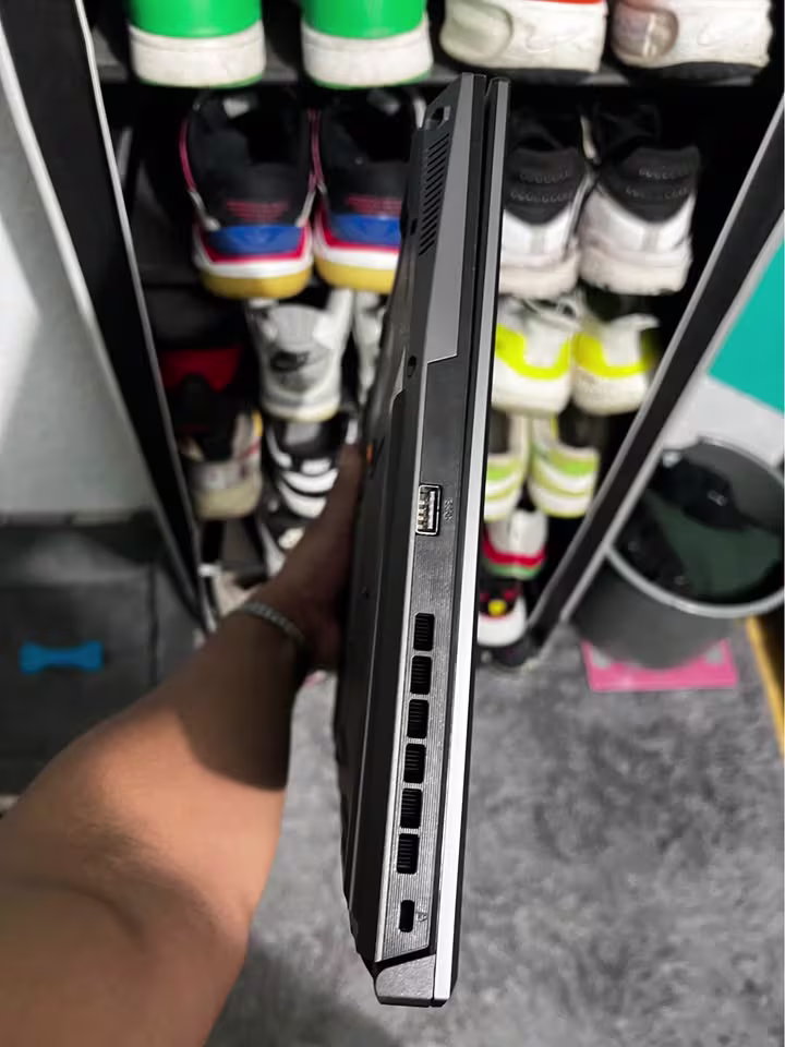 Close view of the left side ports on the ASUS TUF A16 gaming laptop featuring a USB Type-A port, rear cooling exhaust vents, and USB Type-C port.