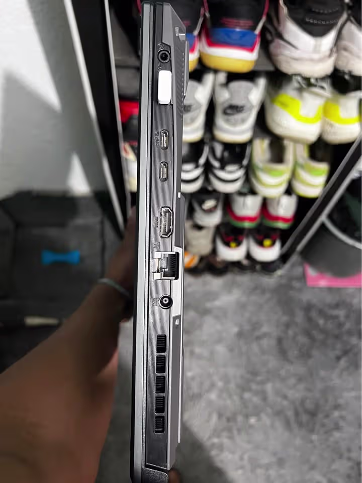 Close right-side ports of the ASUS TUF A16 gaming laptop showing USB Type-C, USB Type-A, HDMI, RJ45 Ethernet, 3.5 mm audio jack, DC power input, and cooling exhaust vent