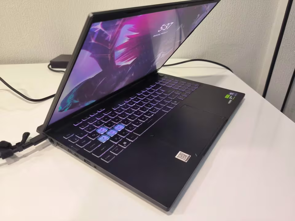 ASUS TUF F16 gaming laptop close view showcasing the display, keyboard, touchpad, and premium chassis design