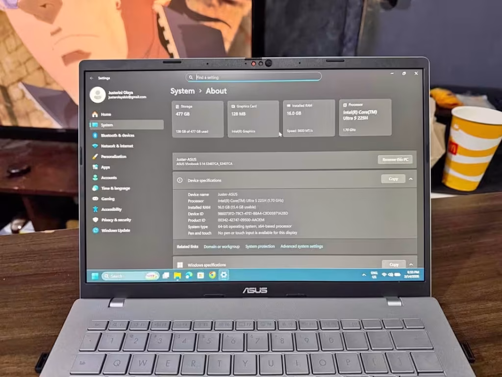 ASUS Vivobook 14 close-up view of the display, slim bezels and system about us showing