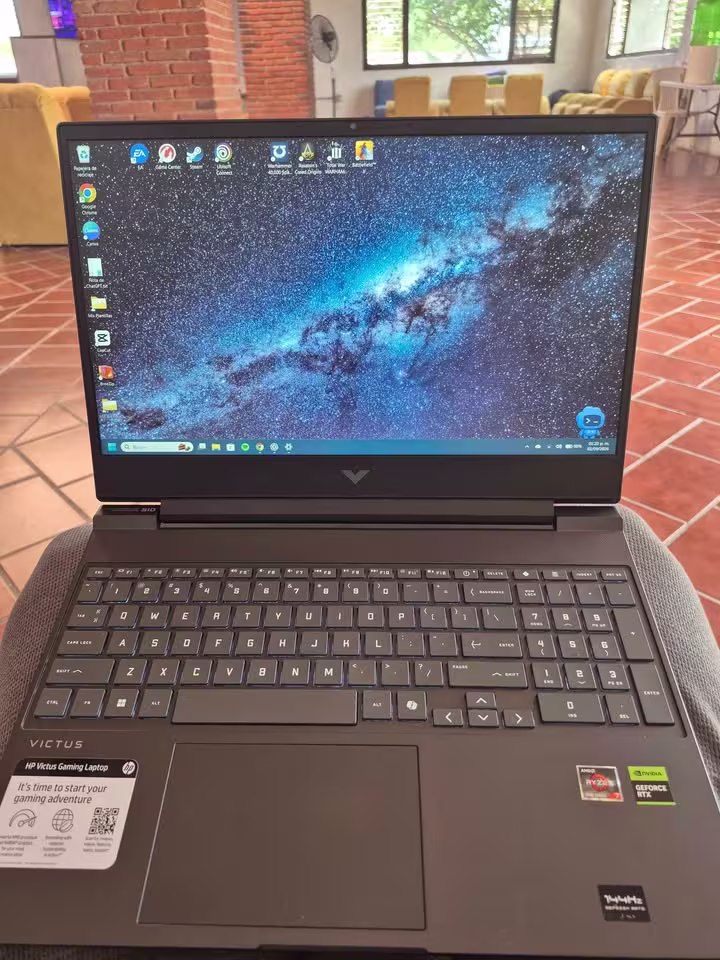 HP Victus gaming laptop with AMD Ryzen 7 processor and NVIDIA GeForce RTX 4050, featuring a high-contrast display with vivid blue and dark tones