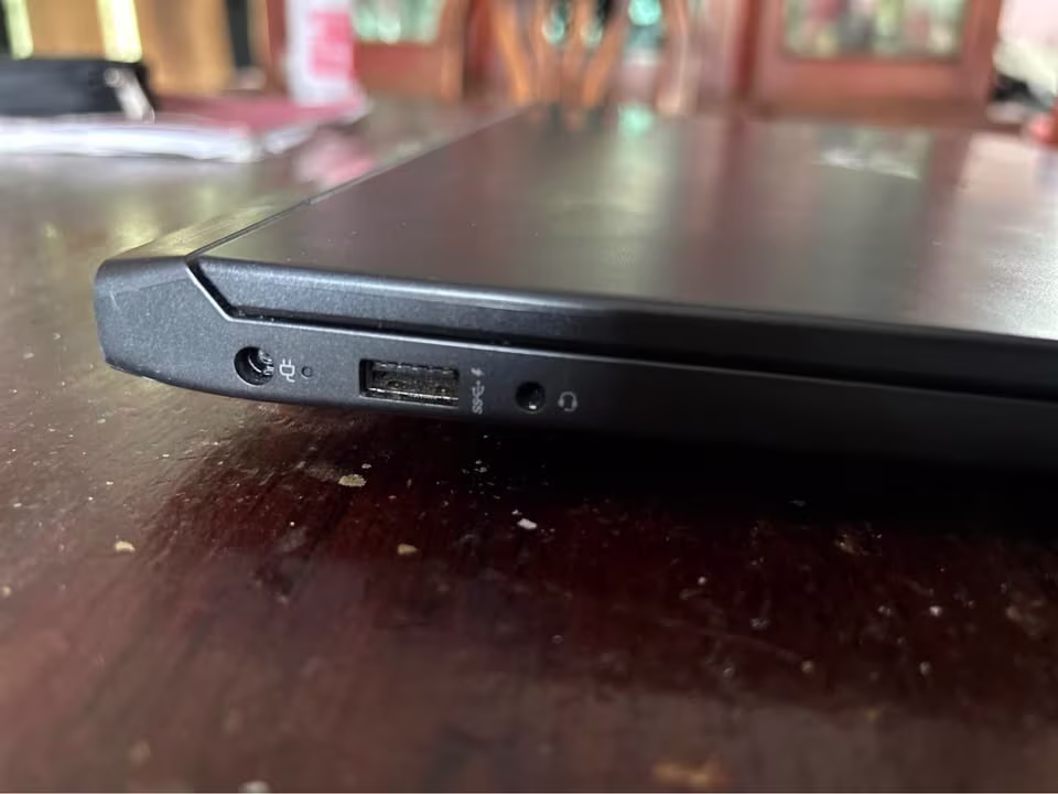 HP Victus AMD Ryzen 7 RTX 4050 laptop left side showing headphone jack, USB Type-A port, and AC Smart Pin power connector