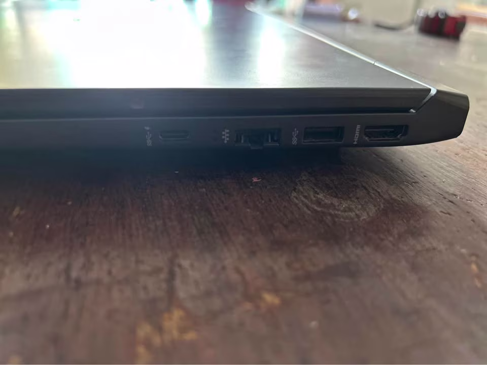 HP Victus laptop with AMD Ryzen 7 and RTX 4050 showing right-side USB Type-C, RJ-45 Ethernet, USB Type-A, and HDMI 2.1 ports