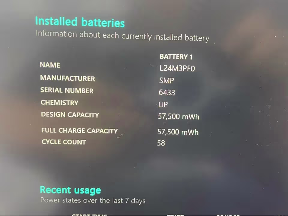 Close view of Lenovo LOQ Essential Ryzen 7 RTX 4050 laptop battery information showing 57,500 mWh design and full charge capacity with 58 cycles