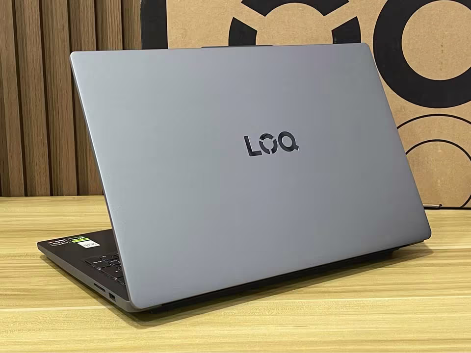 Lenovo LOQ Essential laptop with Ryzen 7 processor and RTX 4050 graphics, rear view showcasing the gray lid and LOQ branding
