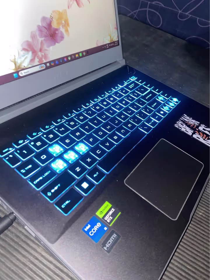 MSI Thin 15 Core i5 RTX 3050 laptop with illuminated keyboard and precision touchpad